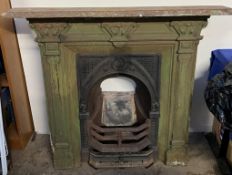 A cast iron fire surround with insert