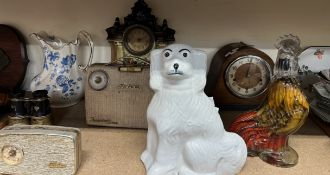 A Staffordshire dog together with a glass pickle cockerel, oak mantle clock, pottery clock,