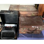 Leather suitcases together with a typewriter