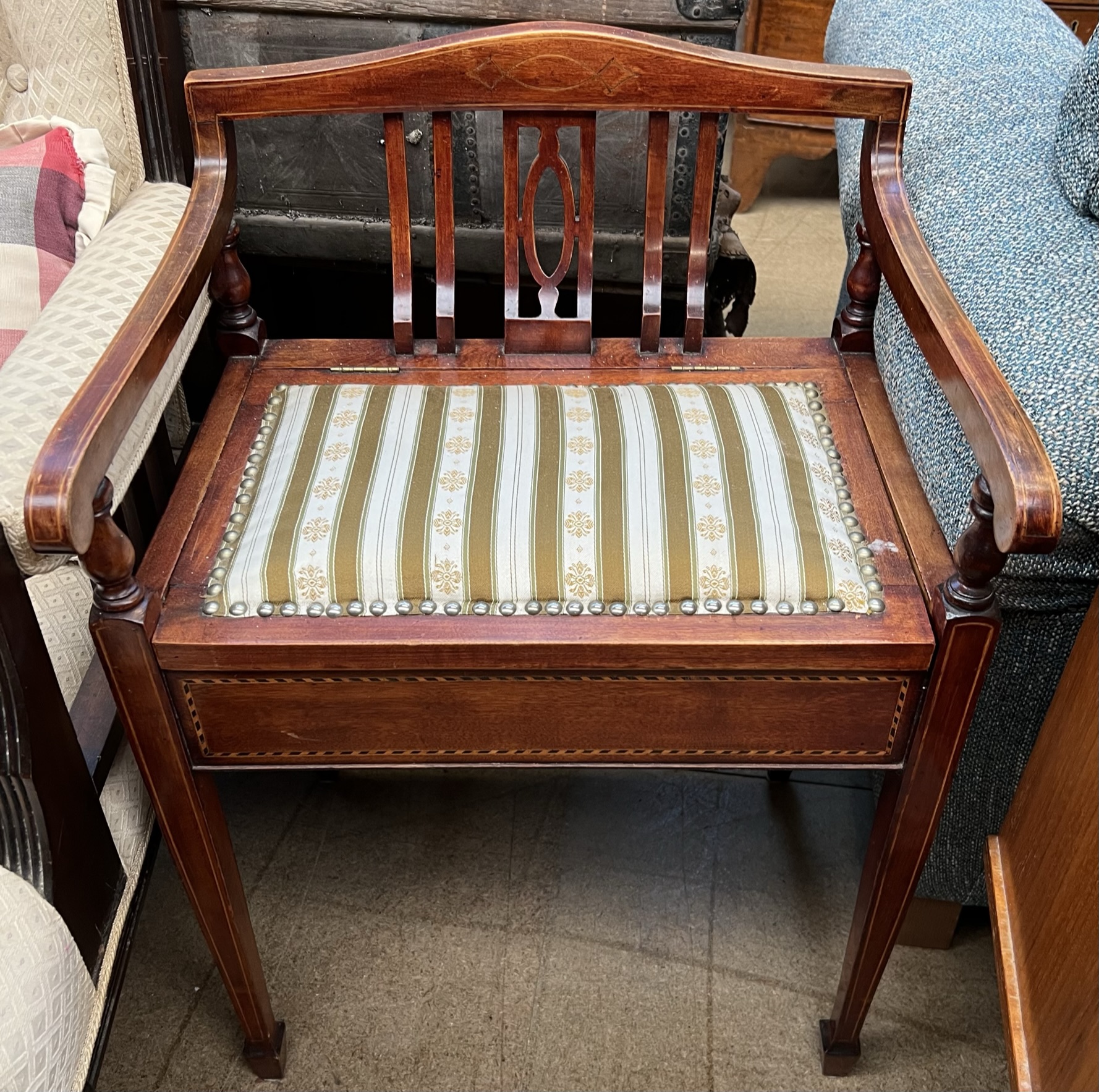 An Edwardian mahogany piano stool,