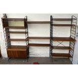 A Mid 20th century teak Ladderax type shelving unit in three sections, with a glass display cabinet,
