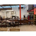A reproduction mahogany extending dining table, together with chairs, sideboard,