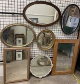 An oak framed wall mirror together with six other wall mirrors