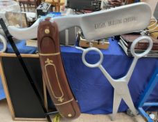 Five barber shop signs in the form of cut throat razors and scissors