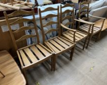 A set of four Ercol elm ladder back dining chairs (includes two carvers)