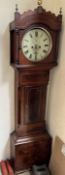 A 19th century mahogany longcase clock, the hood with a shaped cresting, ball and flame finials,