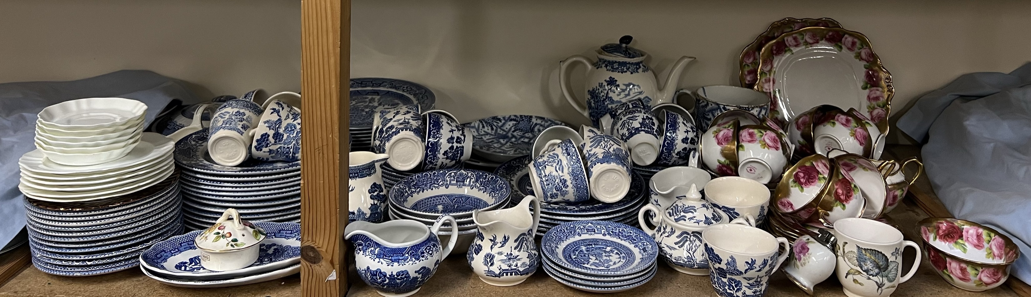 A Royal Albert rose decorated part tea set together with a blue and white matched part tea and