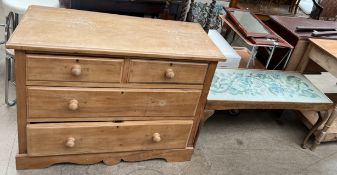 A pine chest with two short and two long drawers on a shaped bracket base