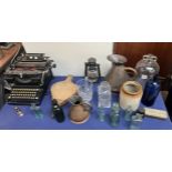 A Remington typewriter together with a demi John, jugs,