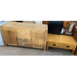 A Modern oak sideboard with two cupboards and three drawers together with a coffee table