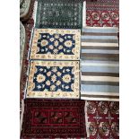 A green ground Turkoman prayer mat together with a red ground prayer rug,