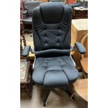 A black leatherette office chair on a swivel base