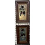 A pair of Edwardian mirrors decorated with vases of flowers and birds contained in oak frames