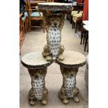 A set of three novelty wine tables in the form of a leopard holding a tree ring