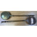 A small brass bedwarming pan together with a small copper bedwarming pan