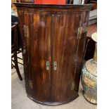 A 19th century mahogany hanging corner cupboard,