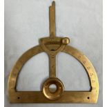 A brass protractor by P Orr and Sons, with swing arm,