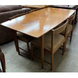 An A H McIntosh & Co teak extending dining table with concealed leaf together with a set of four