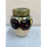 A Moorcroft pottery ginger jar and cover decorated with in the Pansy pattern with tube lined