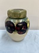 A Moorcroft pottery ginger jar and cover decorated with in the Pansy pattern with tube lined