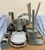 A steel bucket together with boot moulds, pottery plates.