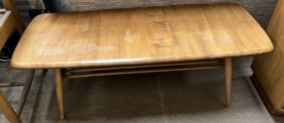 An Ercol coffee table of rectangular form on tapering legs,