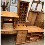 A pine desk together with a pine coffee table,