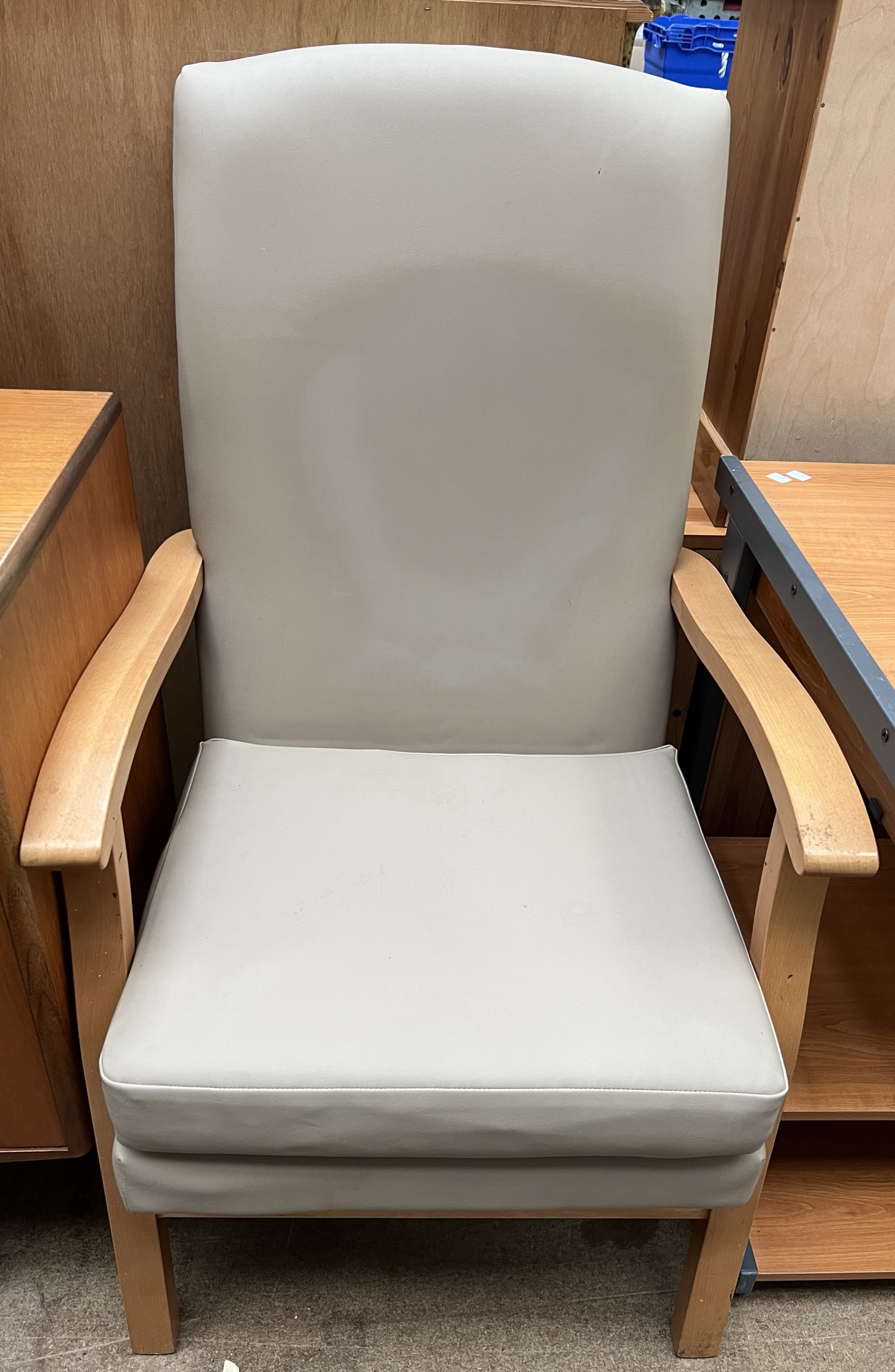 A beech framed upholstered high back elbow chair