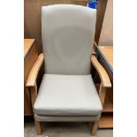 A beech framed upholstered high back elbow chair