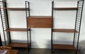 A Ladderax type shelving unit with six shelves and a central drop front bureau