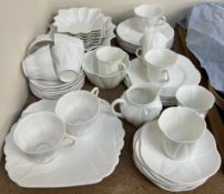 A Shelley porcelain part tea set in white of leaf form