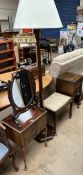 A 20th century mahogany sewing cabinet on cabriole legs and pad feet together with a toilet mirror,