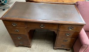 An early 20th century mahogany pedestal desk,