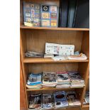 A collection of match box covers together with cigarette box covers, stamps,