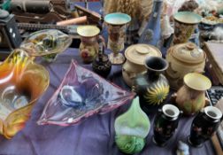 Large coloured glass bowls together with studio pottery and other vases and jugs