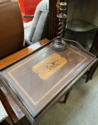 An Edwardian mahogany twin handled gallery tray, inlaid with musical instruments,