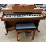 A Yamaha Clavinova CLP-340 electric piano and stool