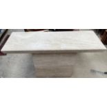 A marble console table with a rectangular top on a box base,