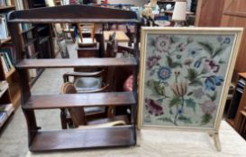 A mahogany hanging shelves together with a woolwork fire screen