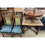 A 20th century extending dining table together with a set of four carved oak dining chairs and a