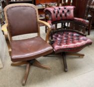 An oak framed swivel office chair together with an upholstered swivel office chair