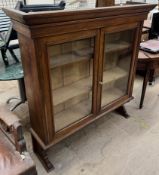 A 19th century oak bookcase with a pair of glazed doors