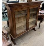 A 19th century oak bookcase with a pair of glazed doors