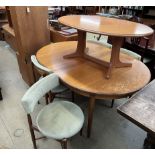A mid-20th century G-Plan teak extending dining table and chairs,