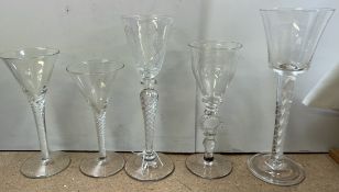 A 19th century wine glass with a tapering bowl and cotton twist stem on a foldover foot together