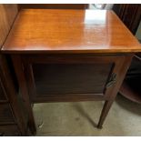 A mahogany pot cupboard with a rectangular top above a panelled door on square tapering legs and