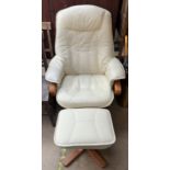 A cream leather swivel chair and matching footstool