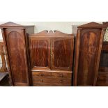 A Victorian mahogany combination wardrobe / chest of drawers with two towers with pointed arches