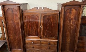 A Victorian mahogany combination wardrobe / chest of drawers with two towers with pointed arches