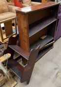 A mahogany waterfall hanging bookcase together with another bookcase